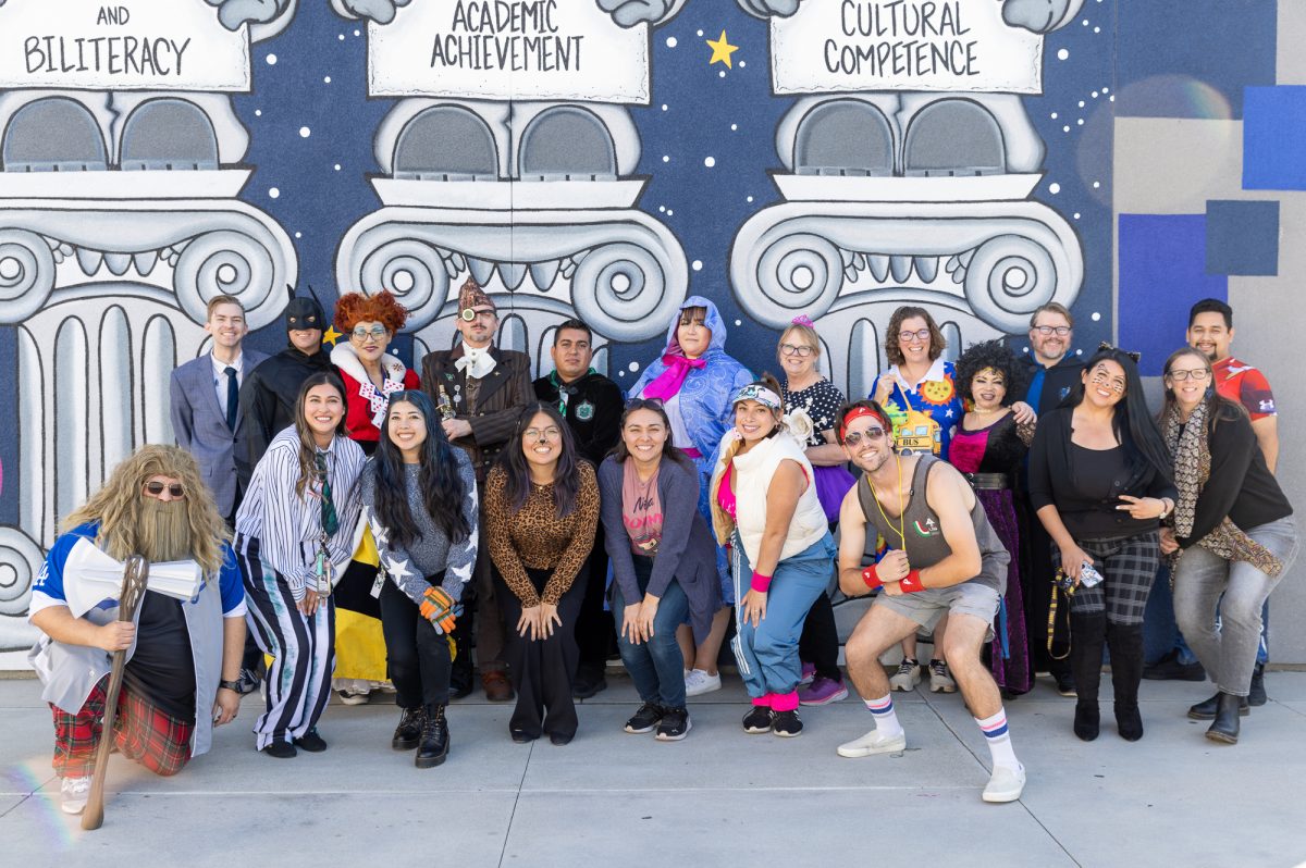 Staff pose for their annual Halloween photo. (Photo credit: Ellis Evans)