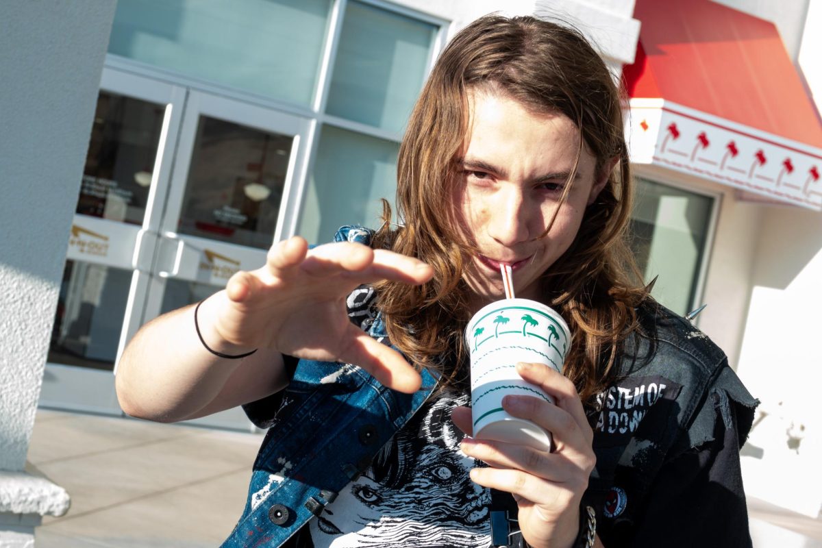 Young voter Kyle Morganelli drinks a shake from In-n-Out while talking politics. (Photo credit: Jude Lopez)