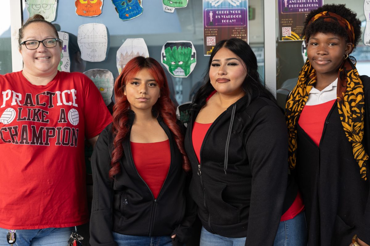 Math teacher Colette Bowles and her sophomore students showing off their red shirts for Red Ribbon Week. From left to right: Colette Bowles (furthest left), Delila Cabrera ('27) (middle left), Alyssa Torres ('27) (middle right), and Malayah Leonard ('27) (furthest right). (Photo credit: Ellis Evans) 