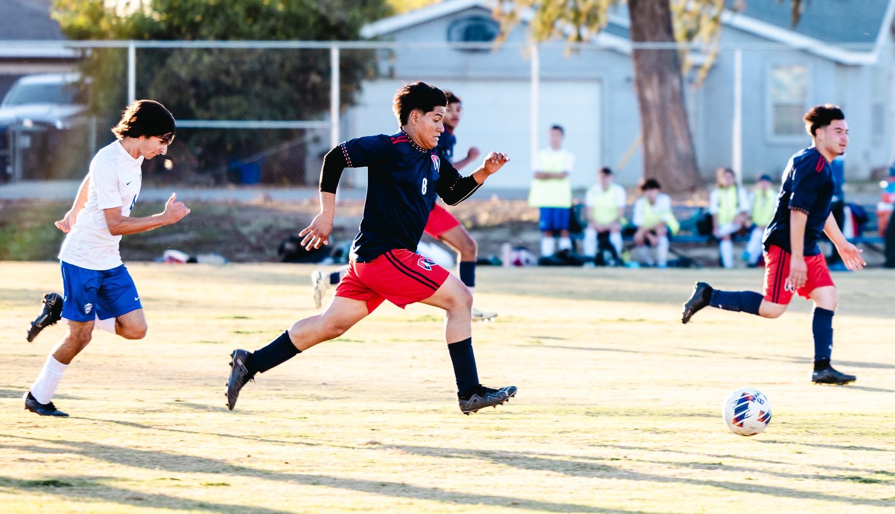 Junior Victor Morfin ('26) sprints to aim for a goal against California Lutheran on Friday, Dec. 6. (Photo credit: Violeta Hernandez) 