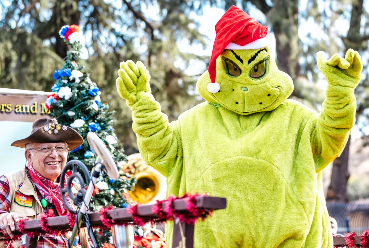 The Grinch wears a Christmas hat to show off holiday spirit. (Photo credit: Ellis Evans)