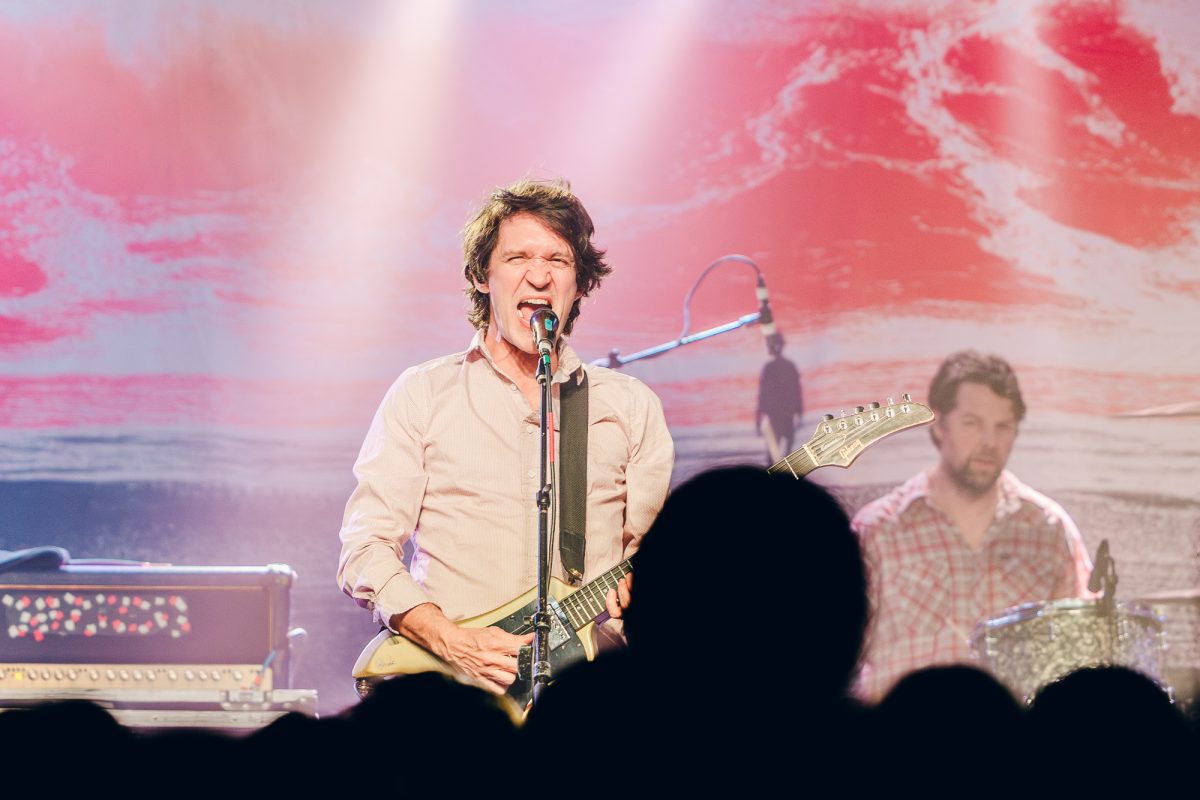 Cursive frontman Tim Kasher screams into the audience while performing at The Glass House in Pomona, California on Feb. 14, 2025. (Photo credit: <a href=