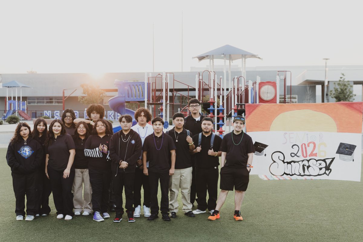 Norton's second-ever senior class stands in the elementary school playground on Aug. 6, 2025, the first day of the school year. The theme for the senior sunrise was a nostalgic, childlike theme to inspire reflection and relaxation. (Photo credit: Betsy Ramirez)  